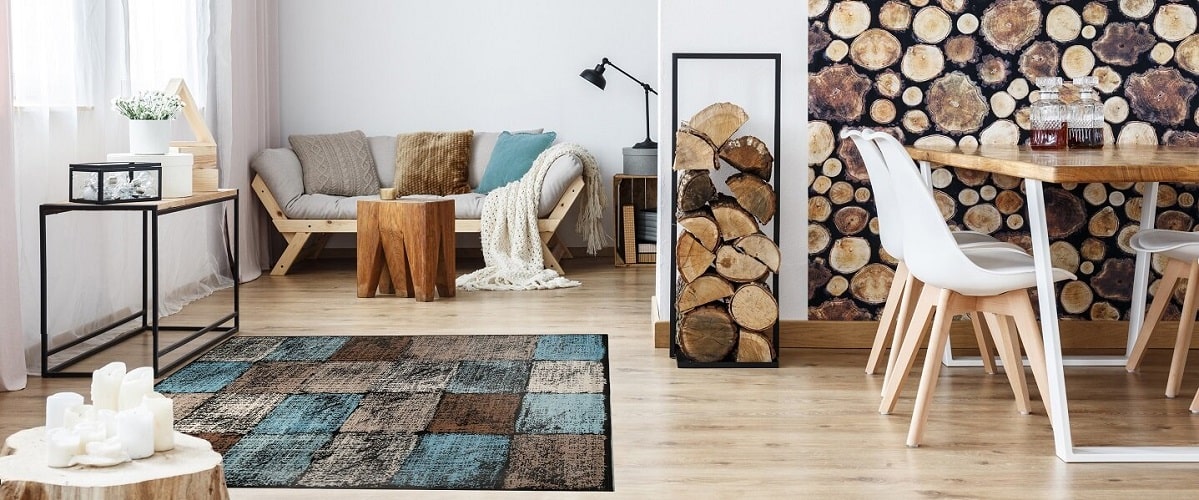Modern Brown Blue Rug in earthy tones with a stack of logs, wooden floor